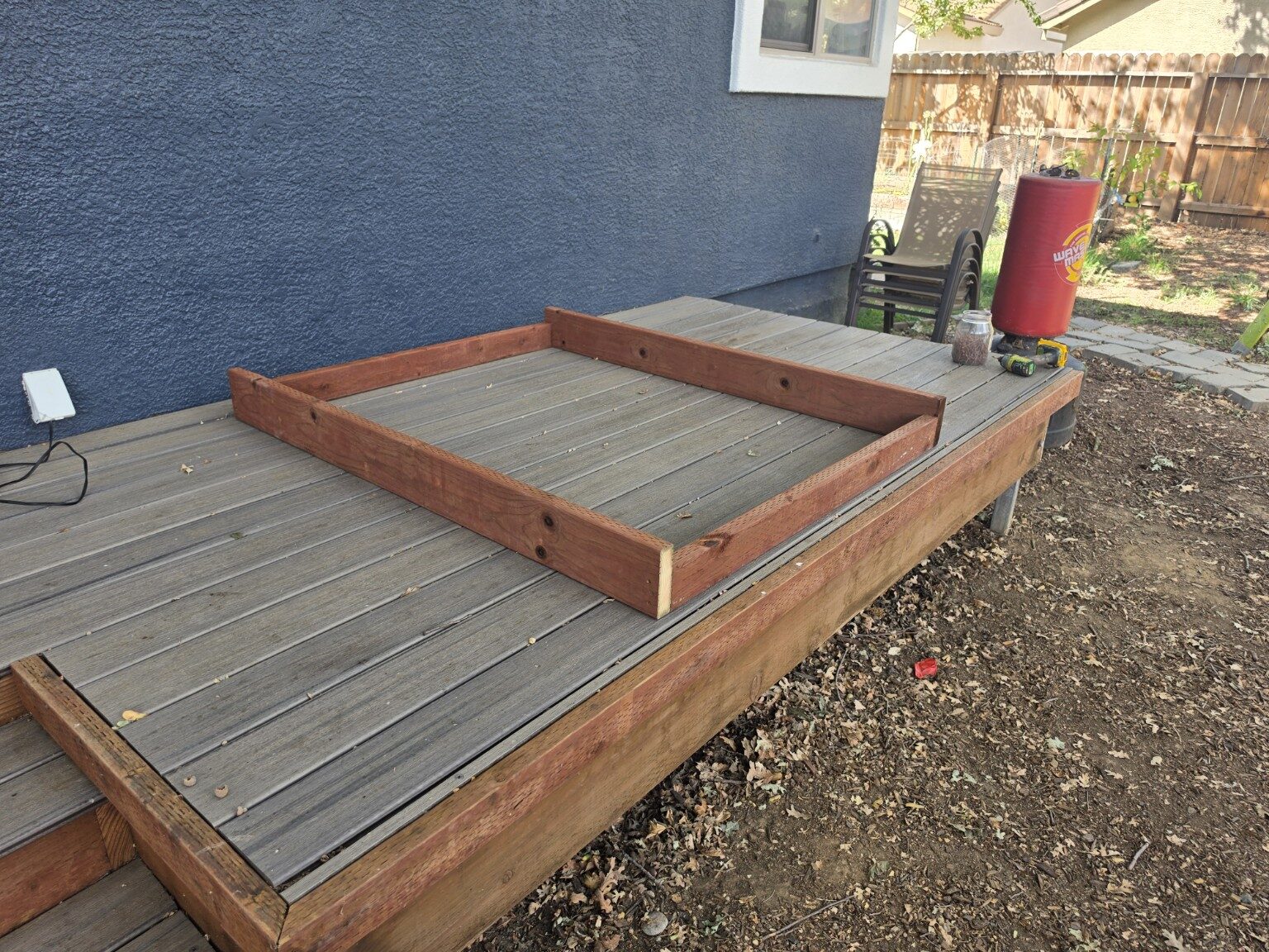 Materials laid out before the custom glass rack build